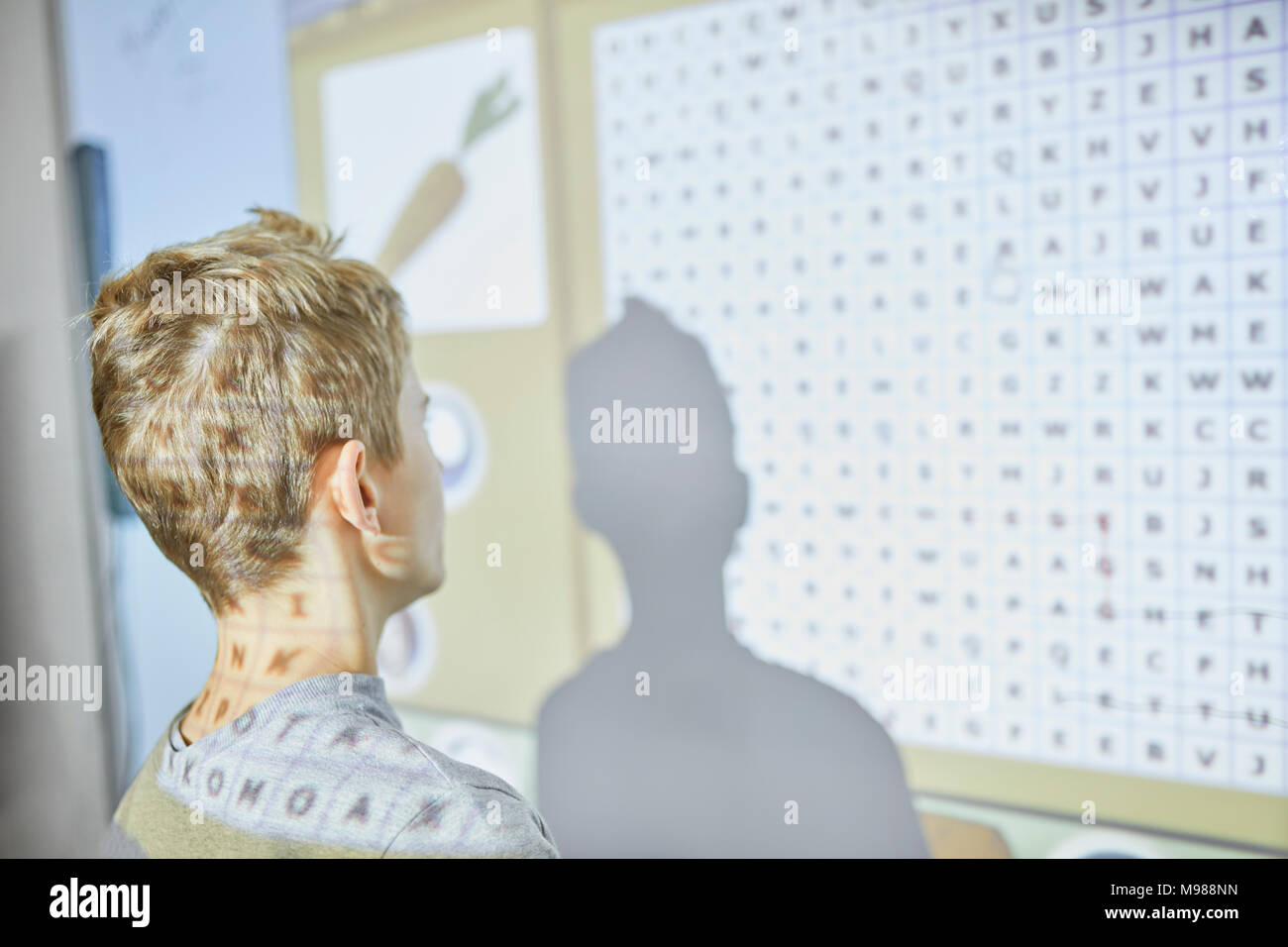 Student in class at interactive whiteboard Stock Photo