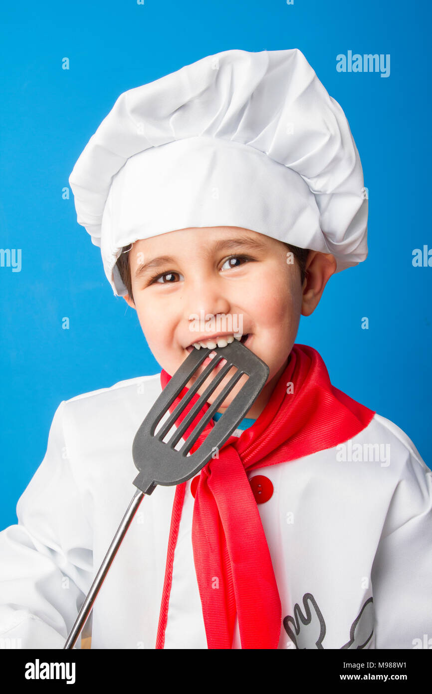 Cooking, The little boy in a suit of the cook. adorable little boy in