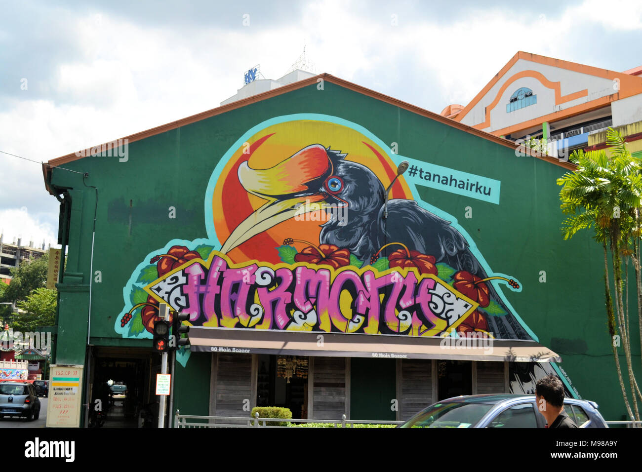 A graffiti of a large yellow billed horn-bill on a shop building in Kuching Sarawak Stock Photo