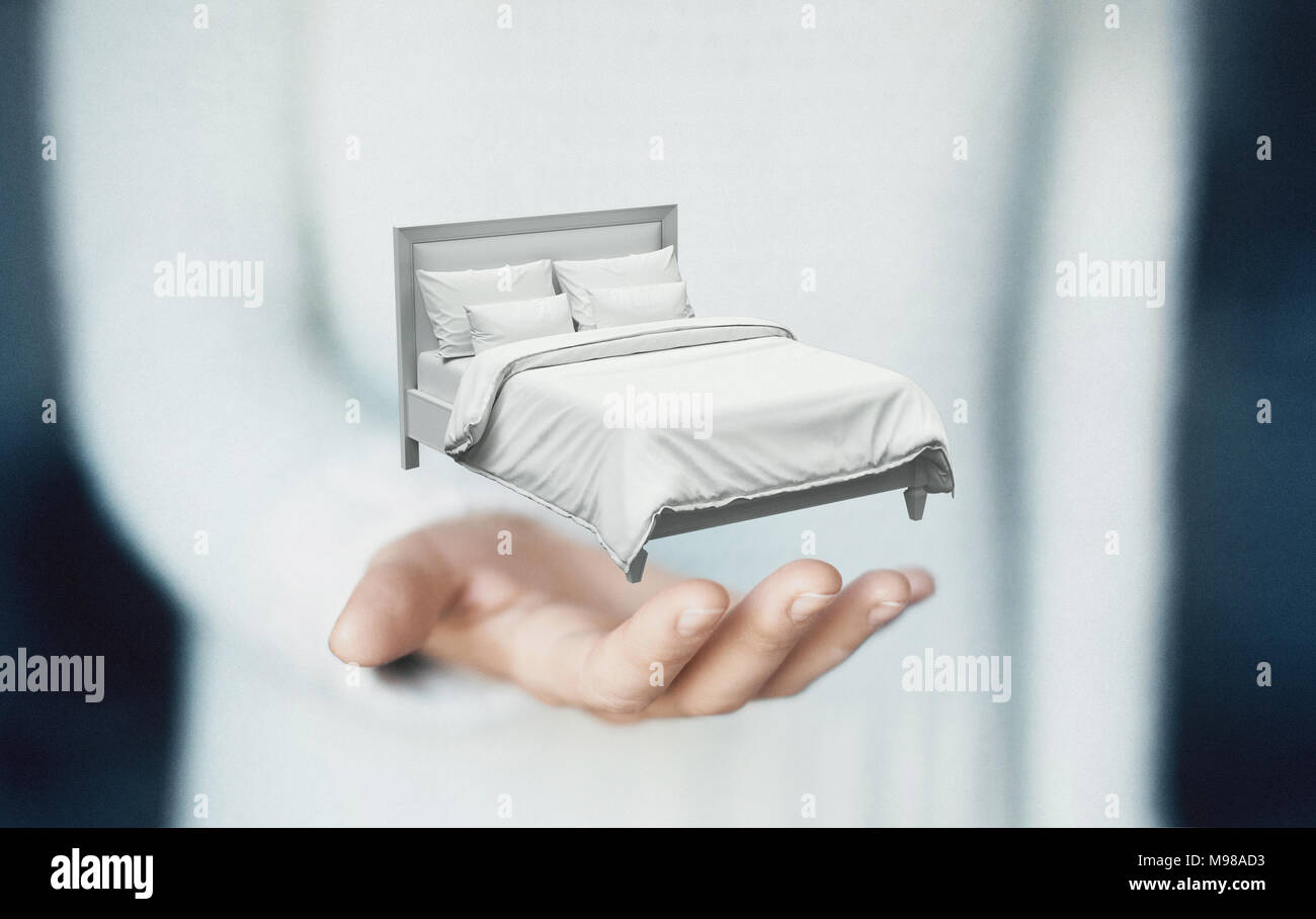 Bed on hands, concept of dream or sleep Stock Photo