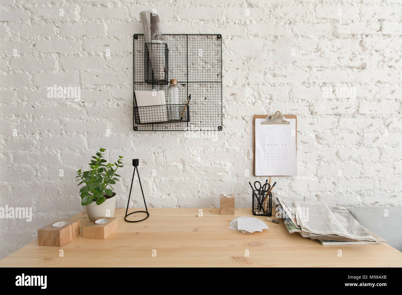 Wooden working table in home office Loft workspace Stock Photo