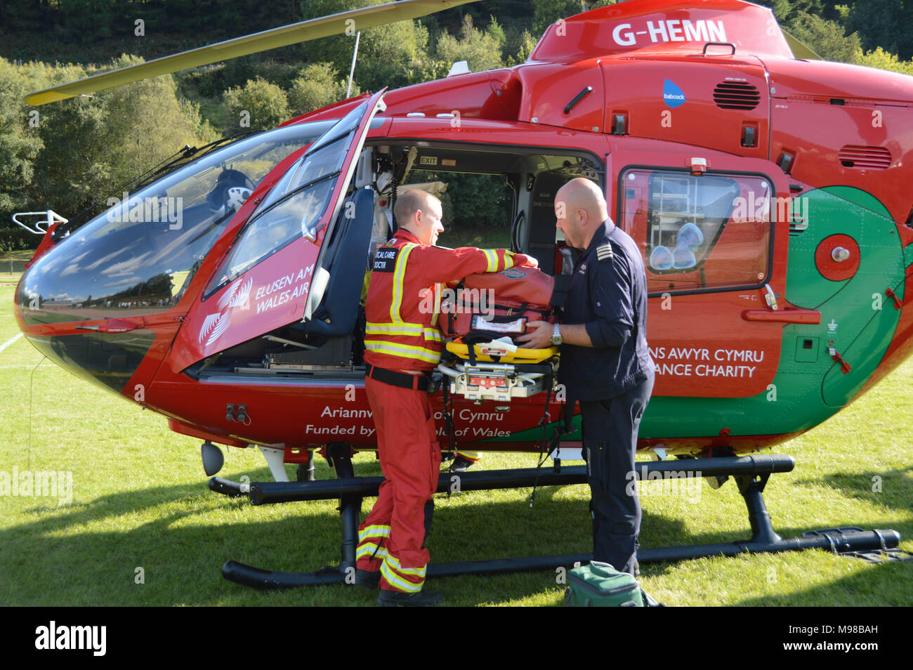 Pilot and doctor outside an Airbus helicopter of the Wales Air Ambulance service Stock Photo