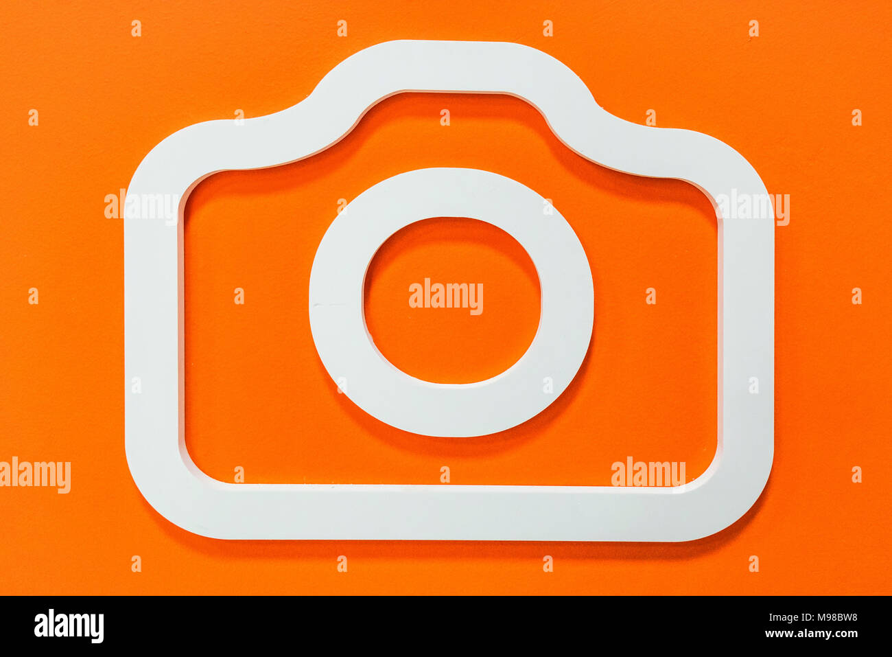 Camera icon on wall in house appliances store Stock Photo