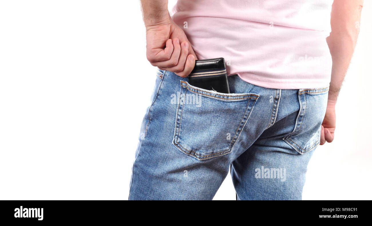 Man put wallet in back pocket of his jeans Stock Photo - Alamy