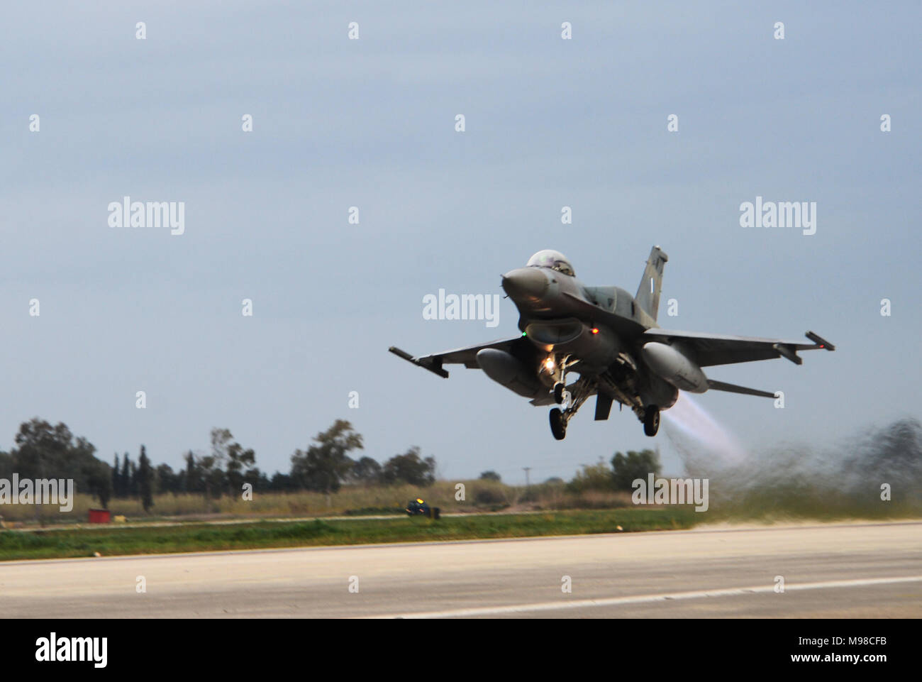 An F-16 Fighting Falcon assigned to the Hellenic Air Forces’ 336th Squadron takes off from Andravida Air Base, Greece, March 21, 2018, during exercise INIOHOS 18. The 336th Squadron are training with the 492nd Fighter Squadron, Royal Air Force Lakenheath, England and other partners and Allies during the exercise to increase interoperability and strengthen partnerships. (U.S. Air Force photo/1st Lt. Elias Small) Stock Photo