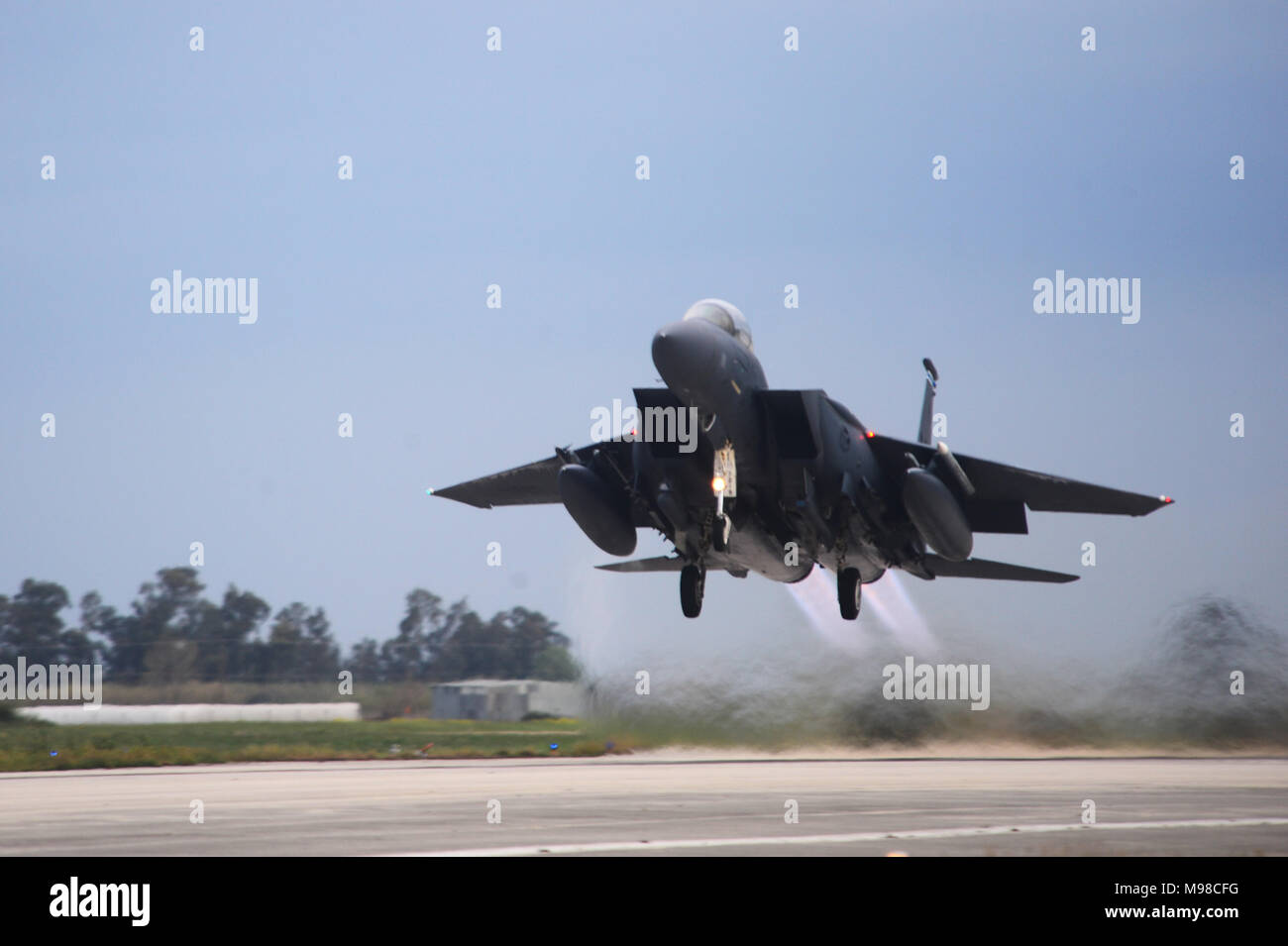 An F-15E Strike Eagle assigned to the 492nd Fighter Squadron, Royal Air Force Lakenheath, England takes off from Andravida Air Base, Greece, March 21, 2018, during exercise INIOHOS 18. The 492nd FS is flying alongside Hellenic Air Force airmen and other partners and Allies during the exercise to increase interoperability and strengthen partnerships. (U.S. Air Force photo/1st Lt. Elias Small) Stock Photo