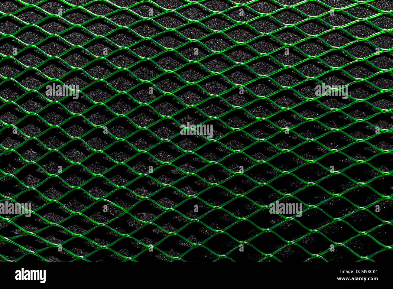Green horizontal net on the black soft background surface Stock Photo