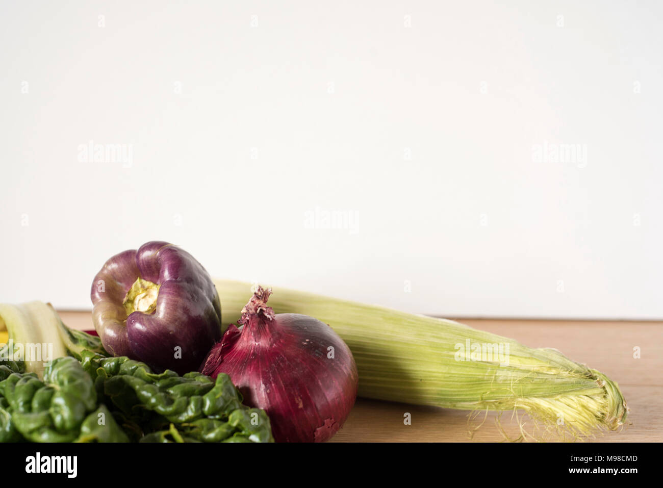 A Bunch of Vegetables on a Wooden Counter Stock Photo