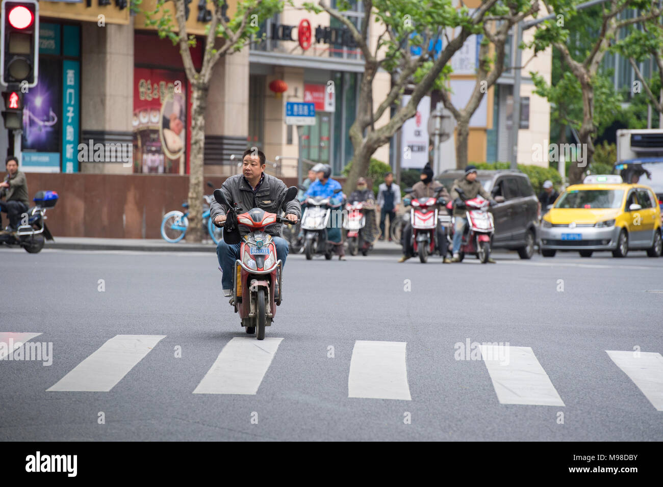 Chinese man riding scooter in High Resolution Stock Photography and ...