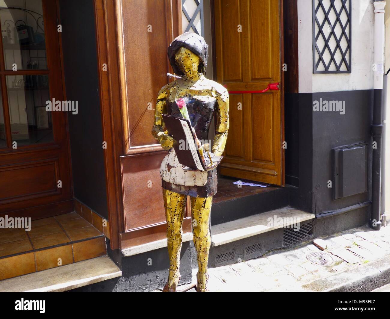 Tin statues outside a restaurant in Montmartre, Paris Stock Photo