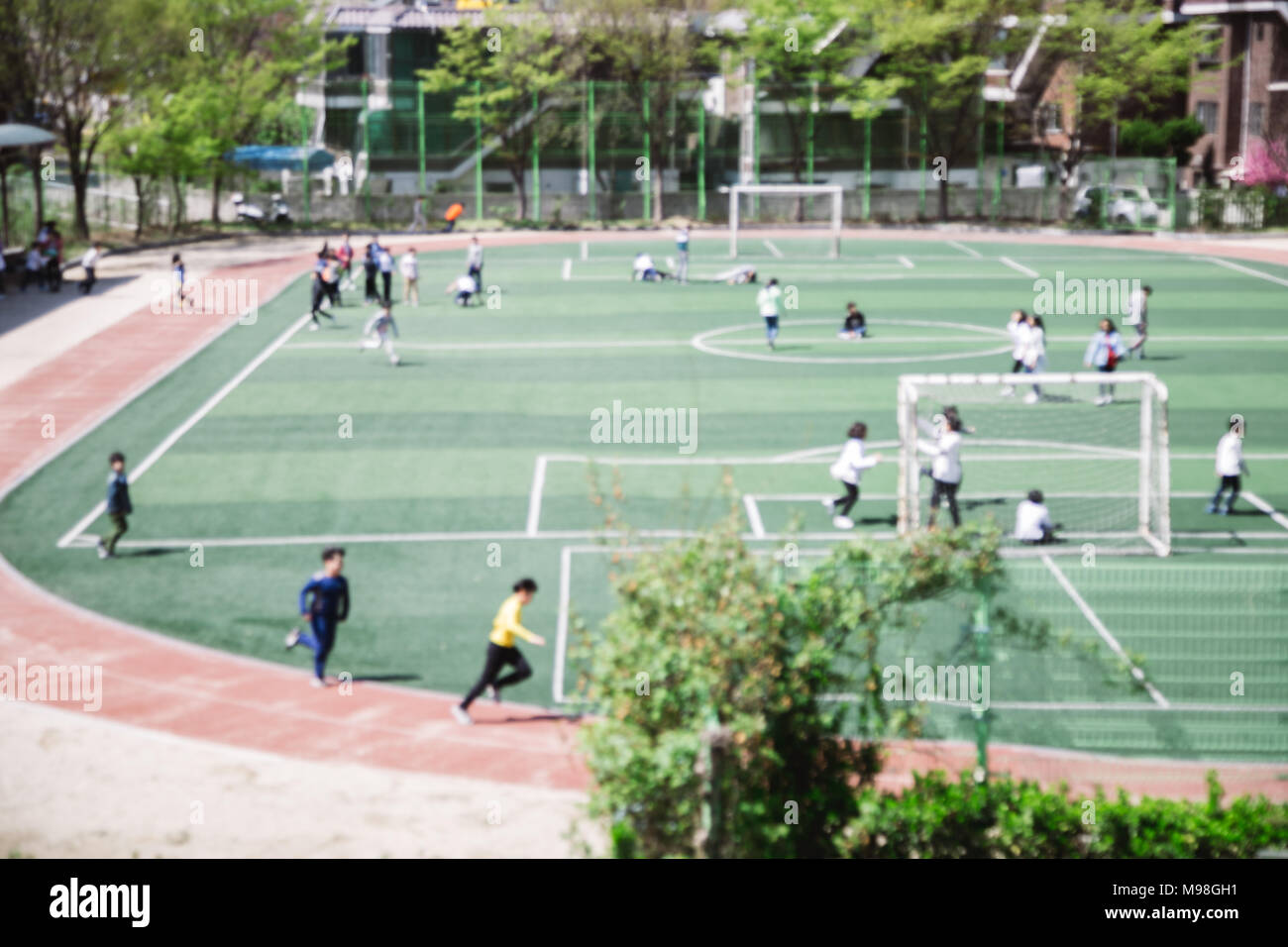 Elementary students on school playground in physical education time in Korea blur focus Stock