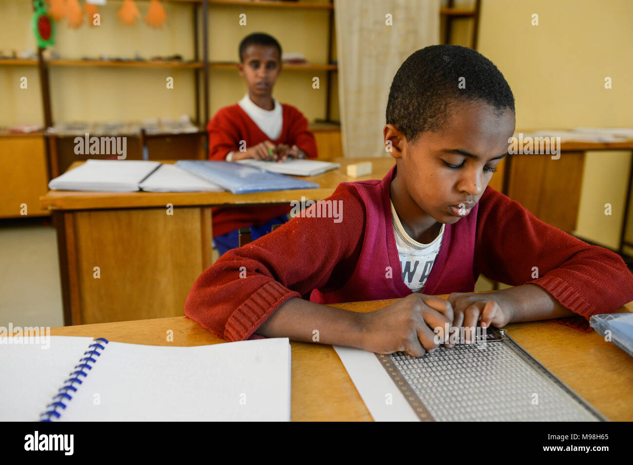 ETHIOPIA, Amhara, Gondar, school for blind children, writing braille letters / AETHIOPIEN, Amhara, Gonder, Schule fuer blinde Kinder, Blindenschrift schreiben Stock Photo