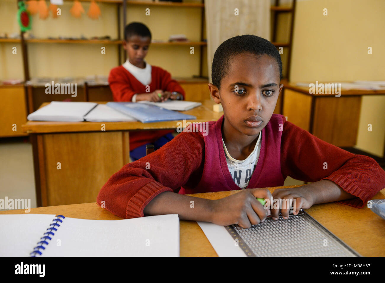 ETHIOPIA, Amhara, Gondar, school for blind children, writing braille letters / AETHIOPIEN, Amhara, Gonder, Schule fuer blinde Kinder, Blindenschrift schreiben Stock Photo