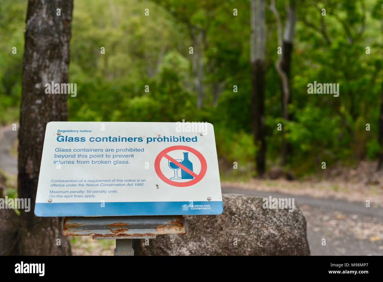 Glass containers prohibited penalties apply sign at big Crystal Creek QLD 4816, Paluma range national park, Australia Stock Photo