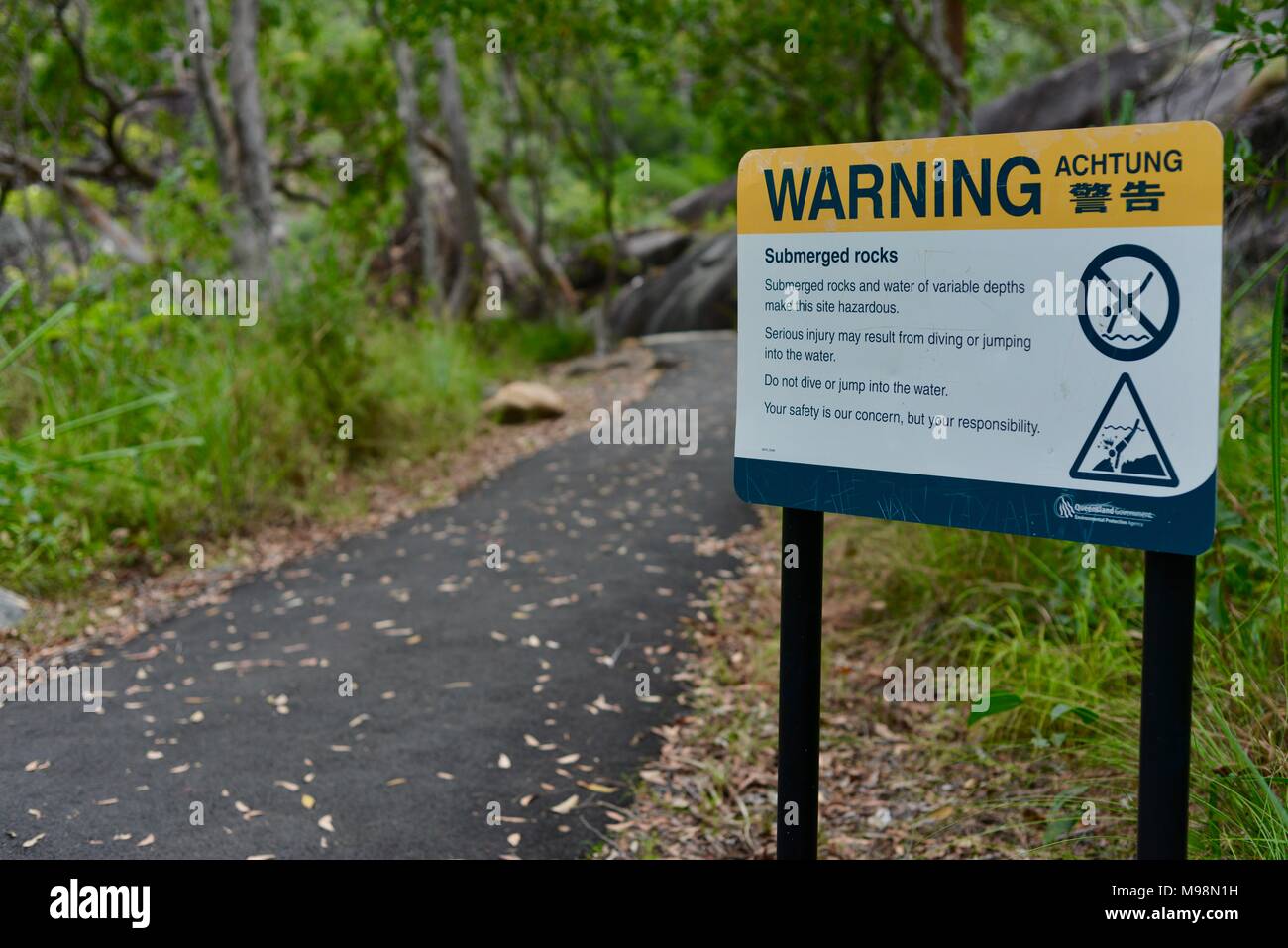Warning achtung sign for no diving into the pool at the rockslides in big crystal creek, Crystal