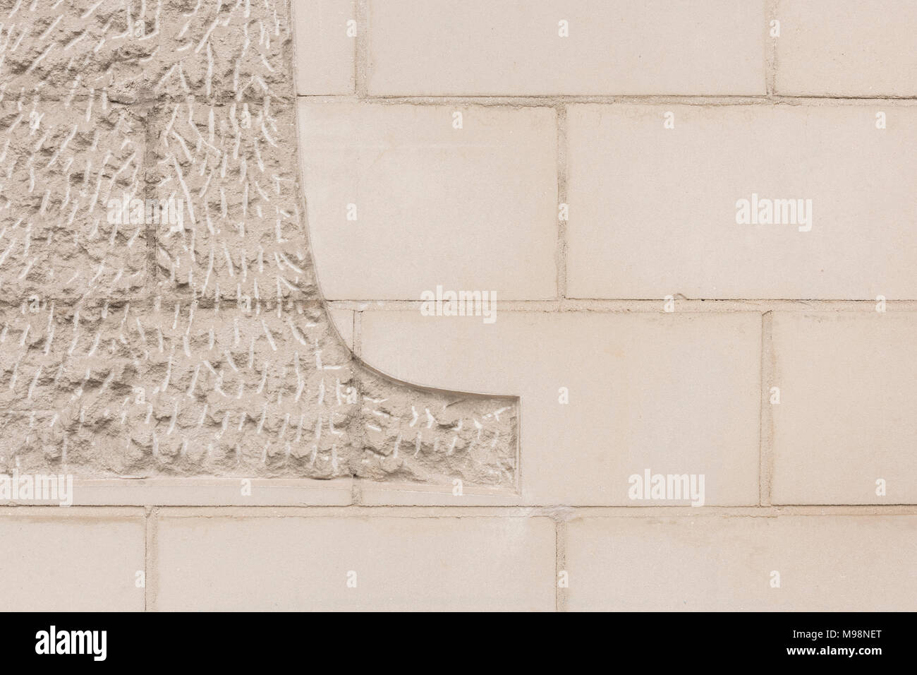 Chiselled / chased limestone facade texture. Stock Photo