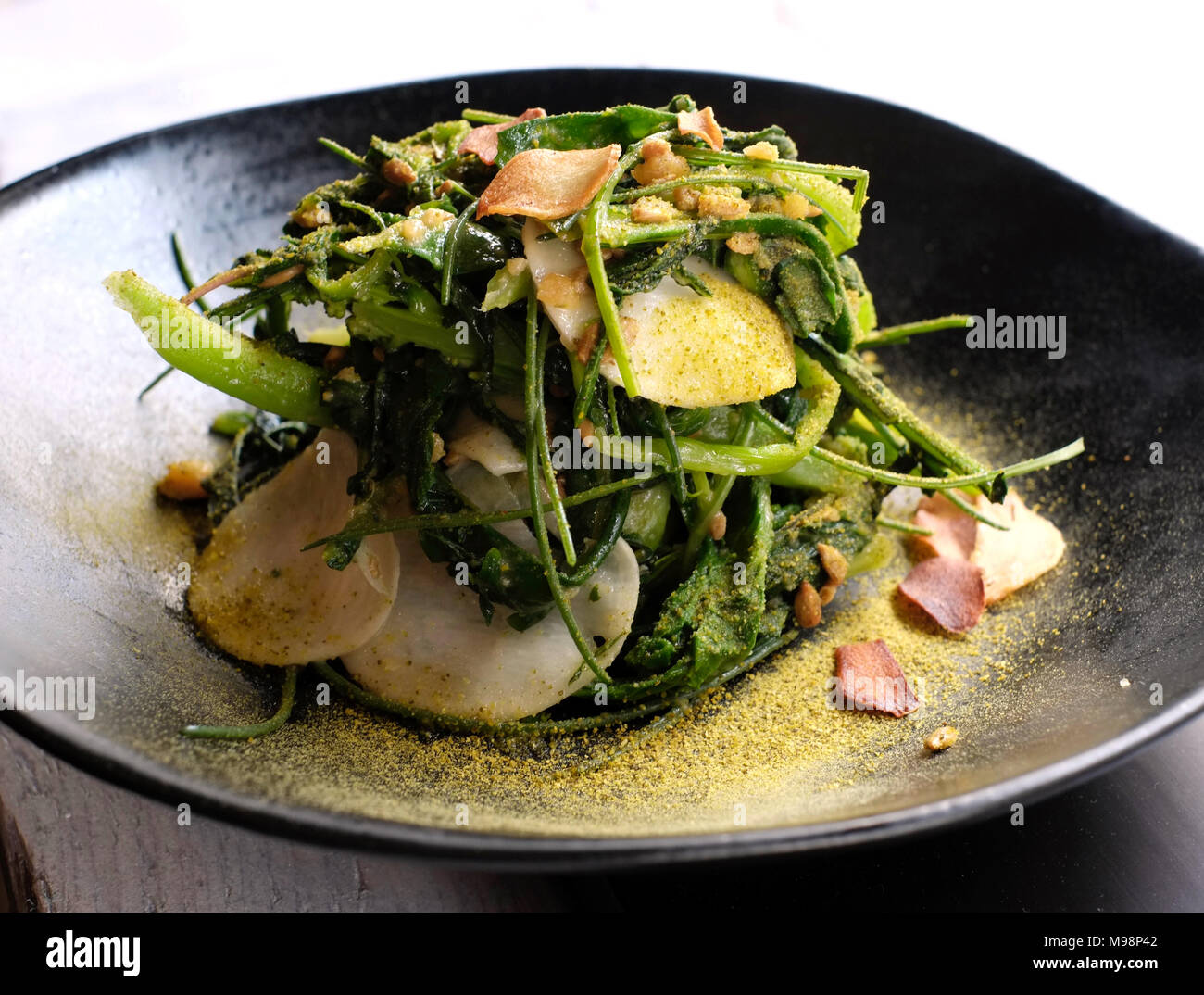 Salad of wilted bitter greens at Scully Restaurant, St James's, London Stock Photo