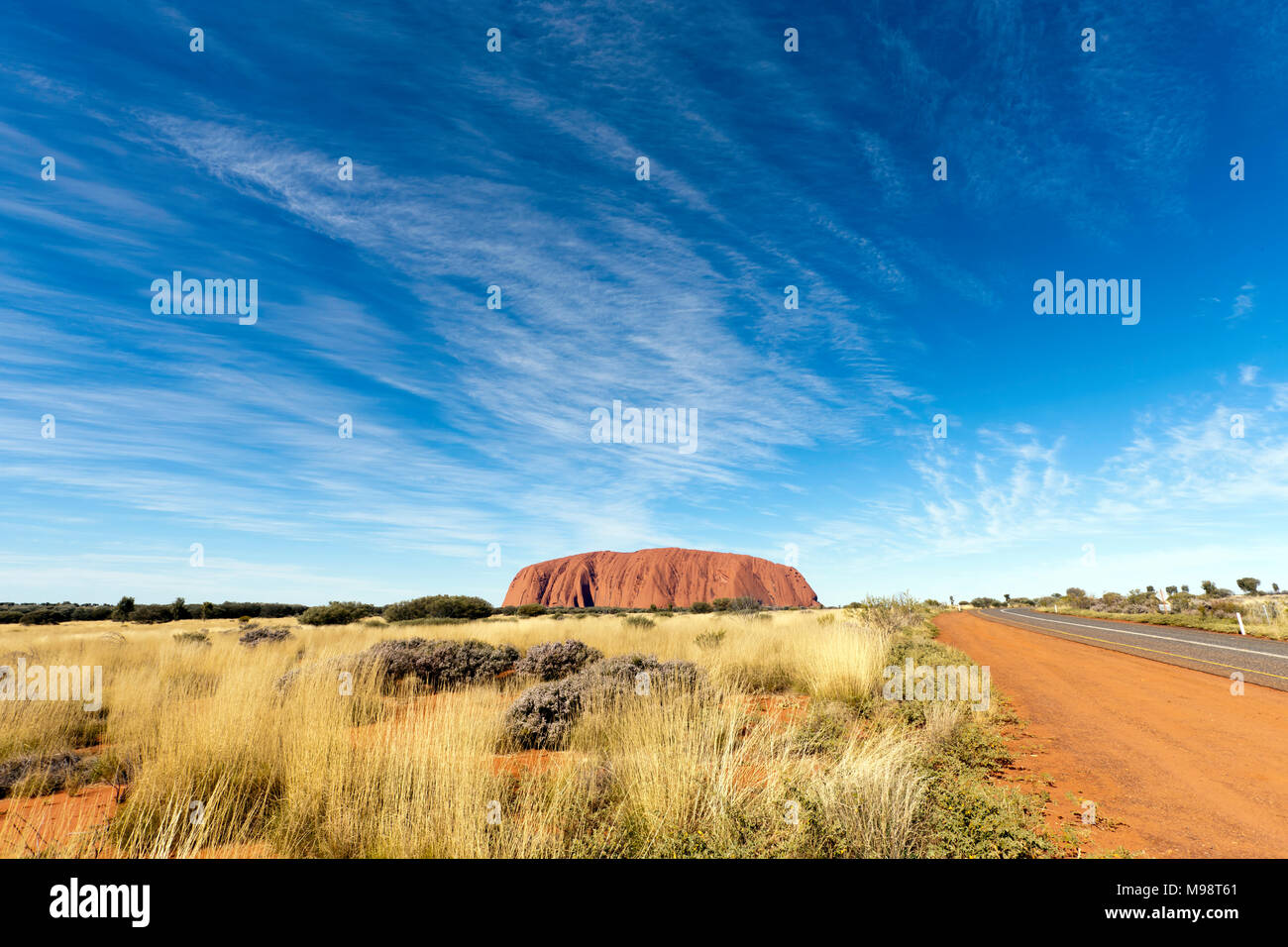 Wide-angle view of Uluru,  as viewed from inside the Uluru–kata tjuta National Park, Northern Territory, Australia Stock Photo