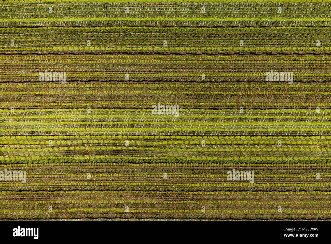 Fabric with a brown - green background with abstract  patterns. Close-up. Stock Photo