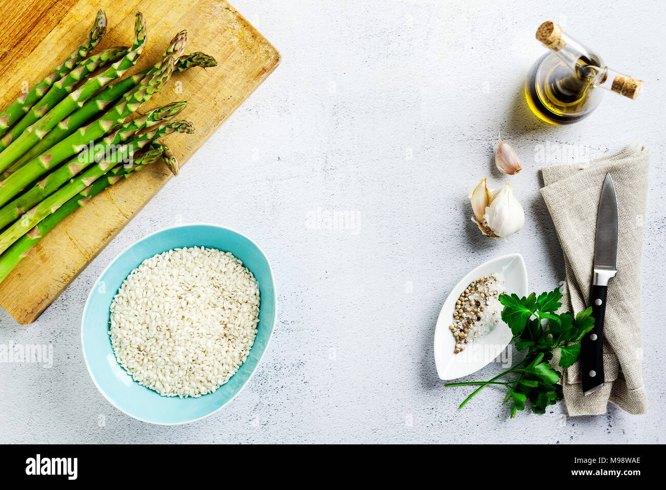 Ingredients In Risotto Ingredients for cooking risotto with asparagus on a table Stock Photo ...