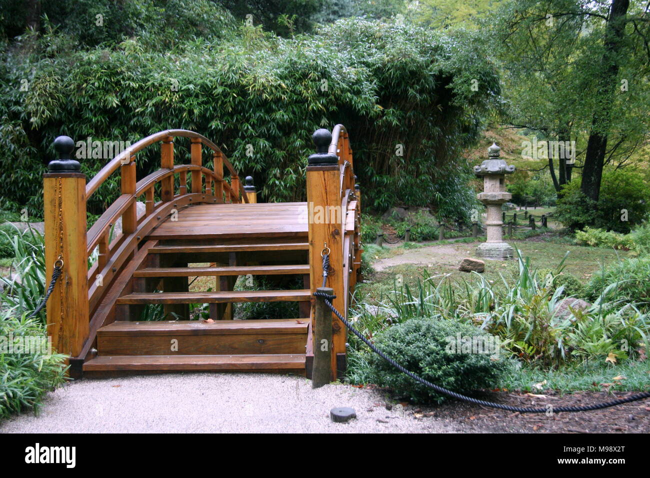 Oriental gardens with brown bridge pathways Stock Photo