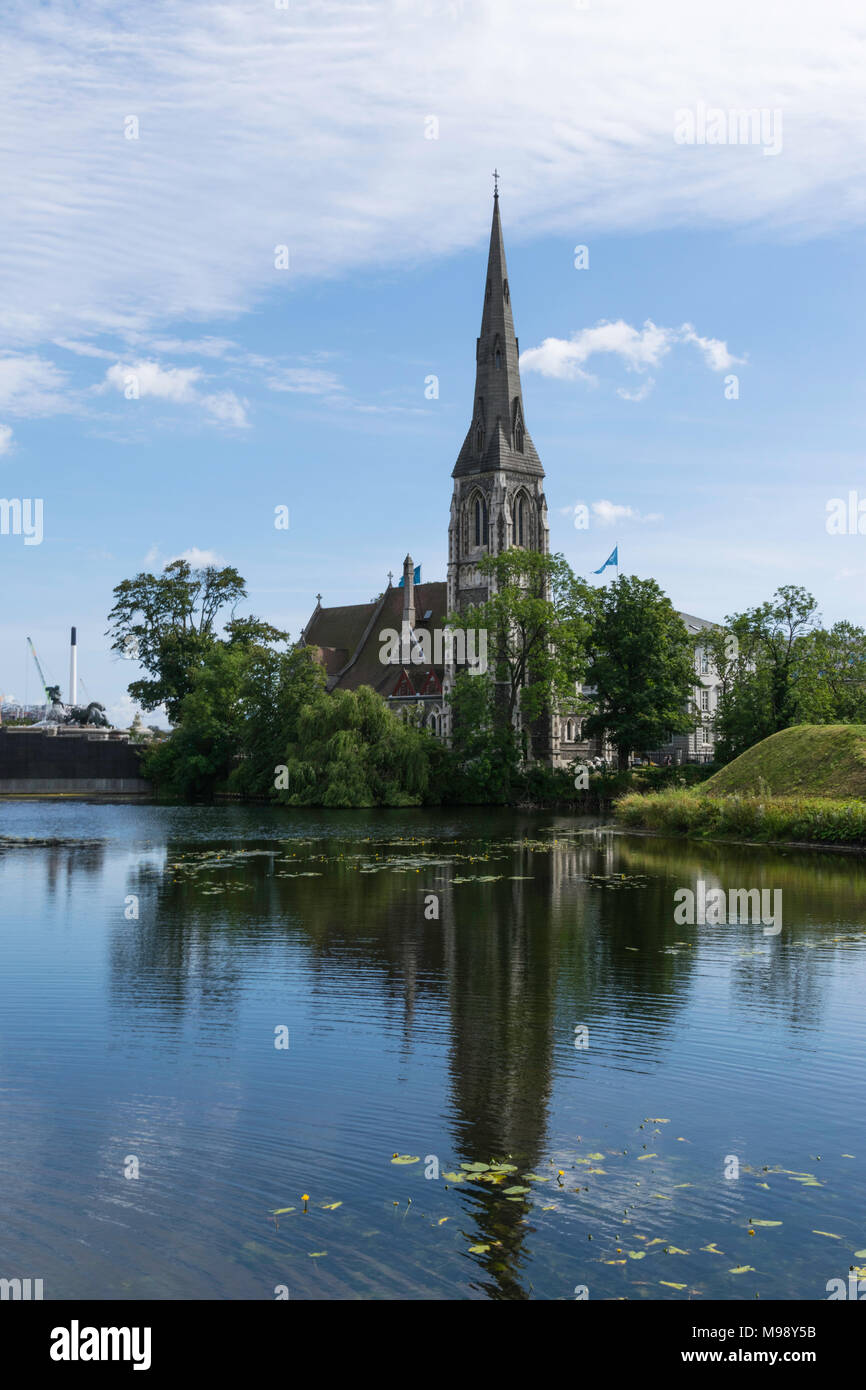 St Alban's Church in Copenhagen Denmark viewed across the water with reflection Stock Photo