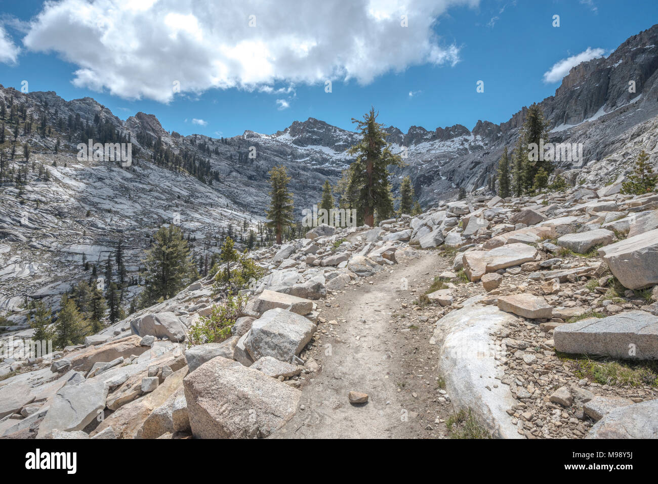 The Lakes Trail is a 13 mile trail in Sequoia National Park that leads to four snow-melt lakes, Heather, Emerald, Aster, and Peak Lake. Stock Photo