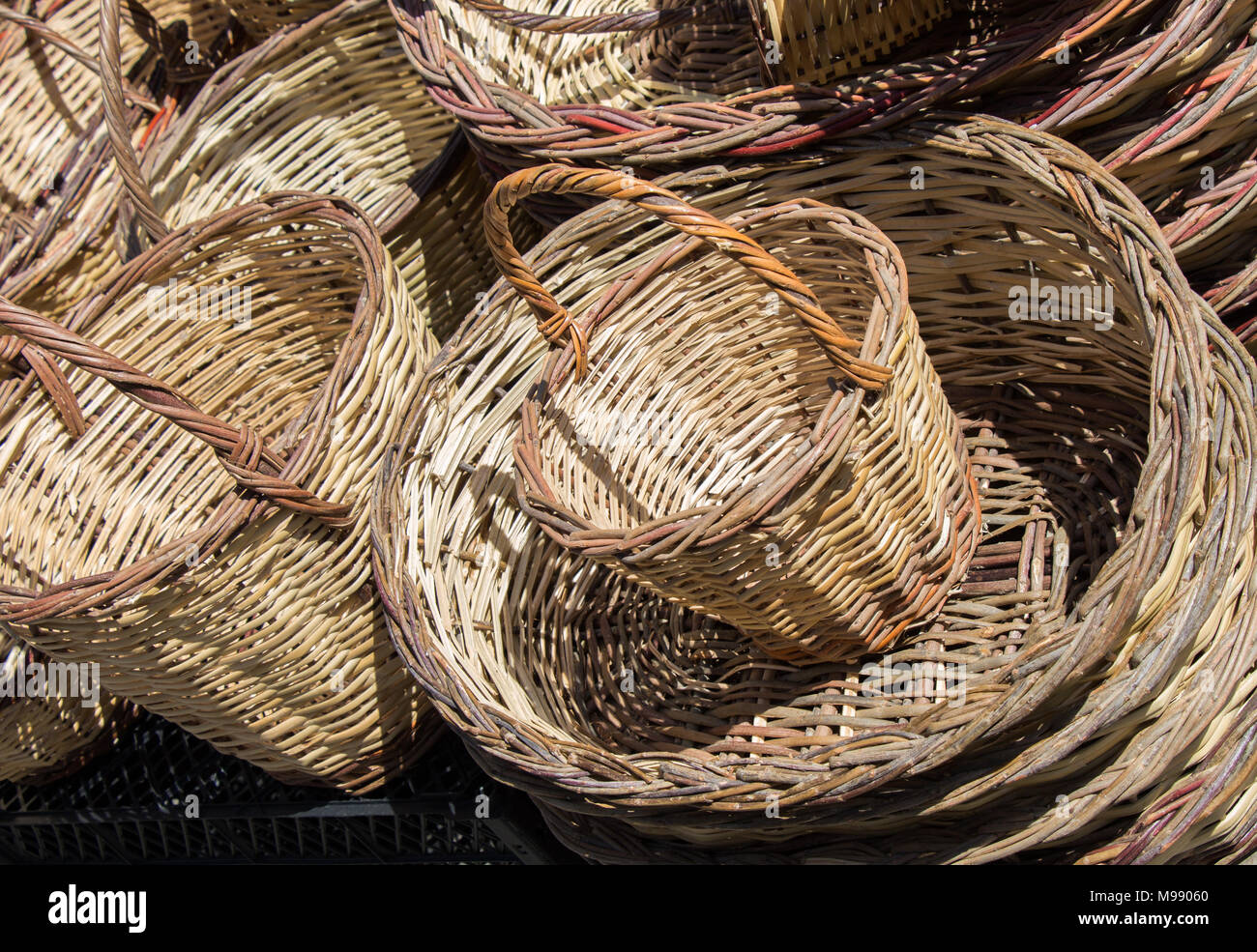 Empty wicker baskets are for sale in a market place Stock Photo - Alamy