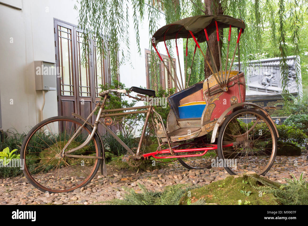 tricycle in the public garden Stock Photo Alamy