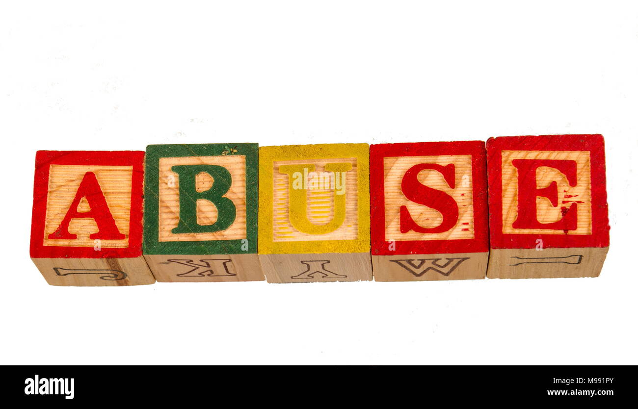The term abuse visually displayed on a white background using colorful wooden toy blocks image in landscape format Stock Photo