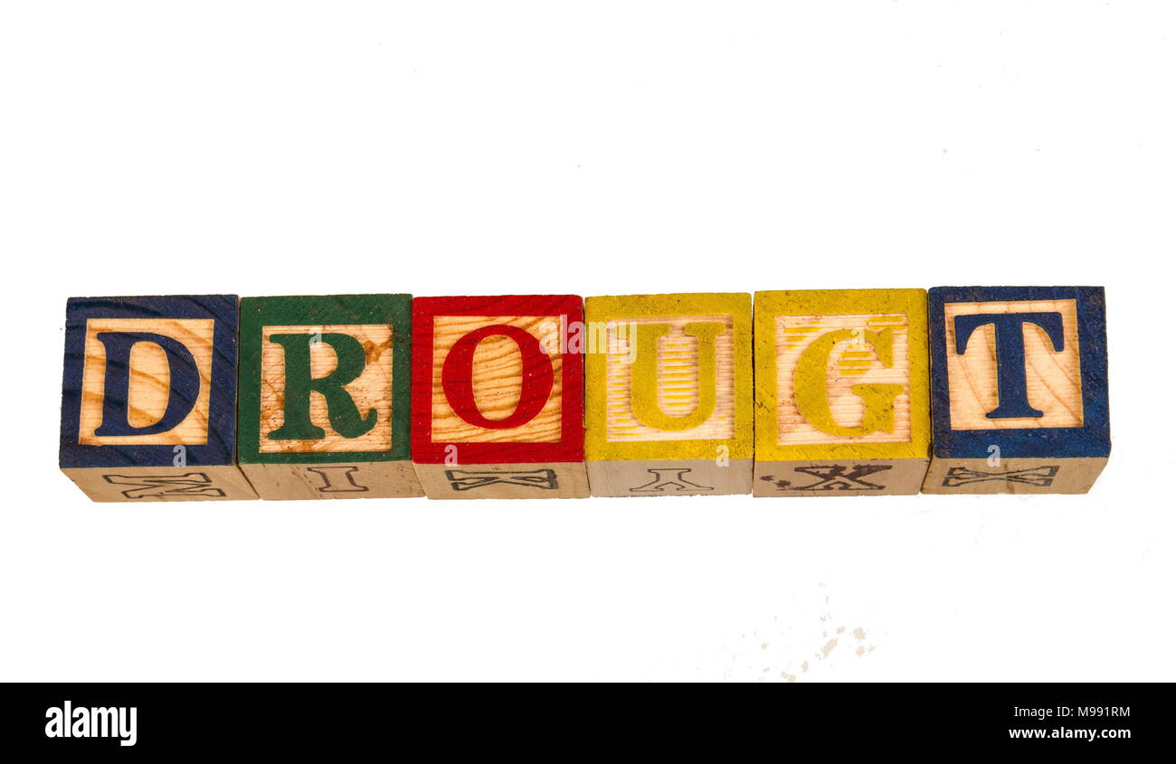 The term drought visually displayed on a white background using colorful wooden toy blocks image in landscape format Stock Photo