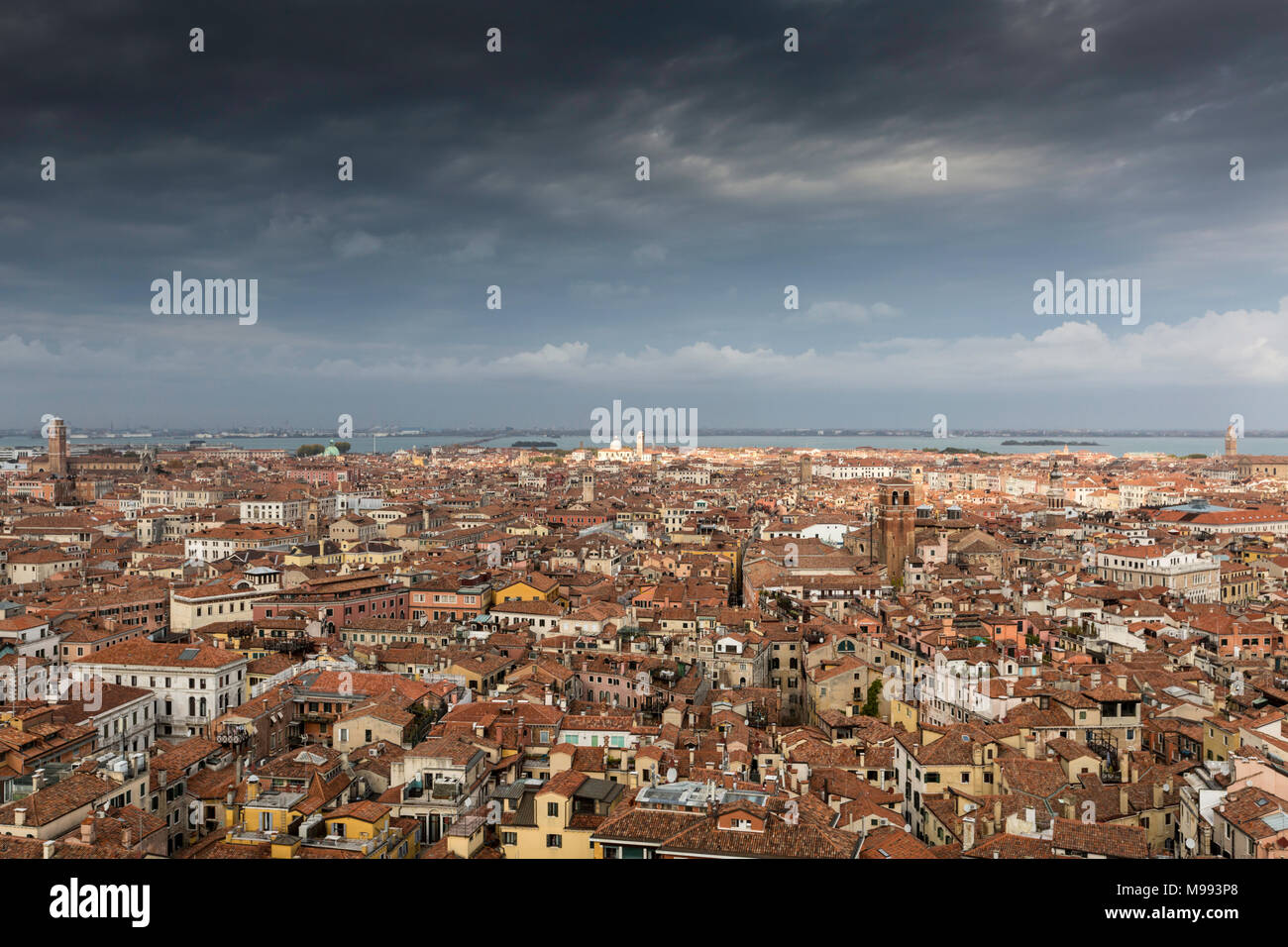 View across the red rooftops from the Campanile in St Mark's Square looking north showing the different styles of architecture - Venice, Italy. Stock Photo