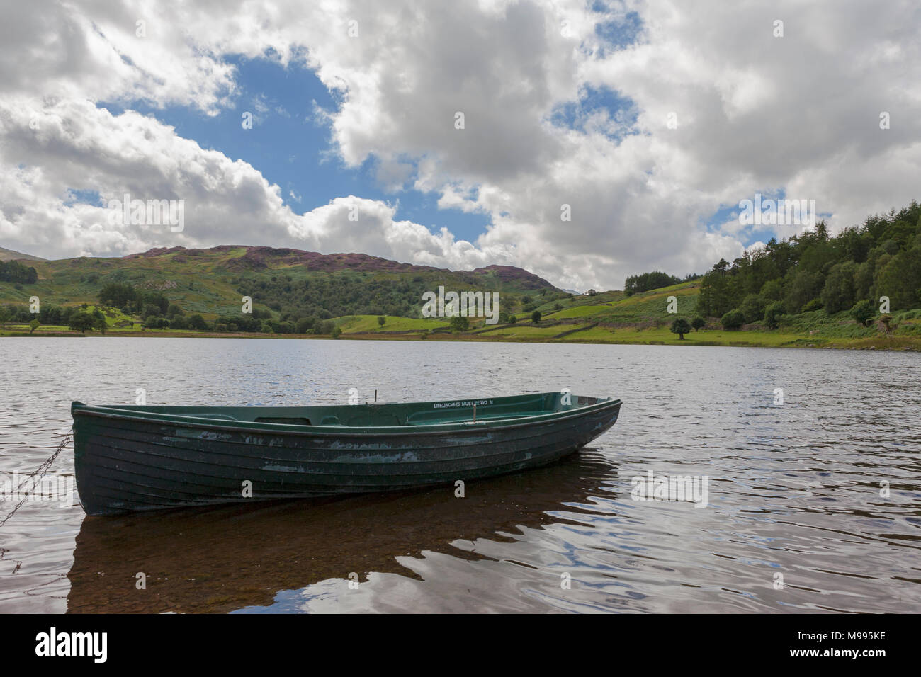 Rowing boat on Watendlath Tarn, Lake District, Cumbria, England, UK Stock Photo