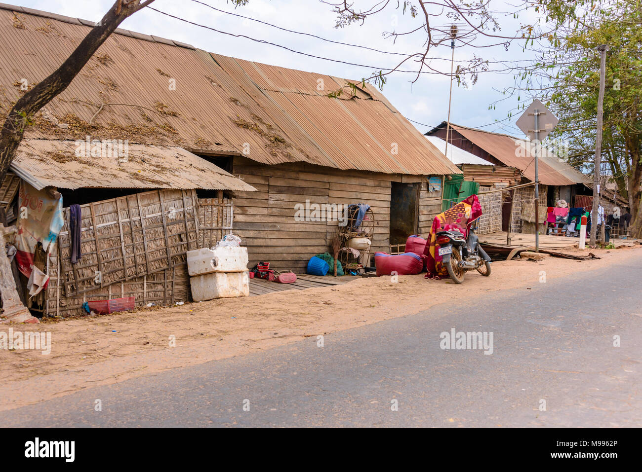 Cambodian farm house made from wooden planks and corrugated iron, Cambodia. Stock Photo