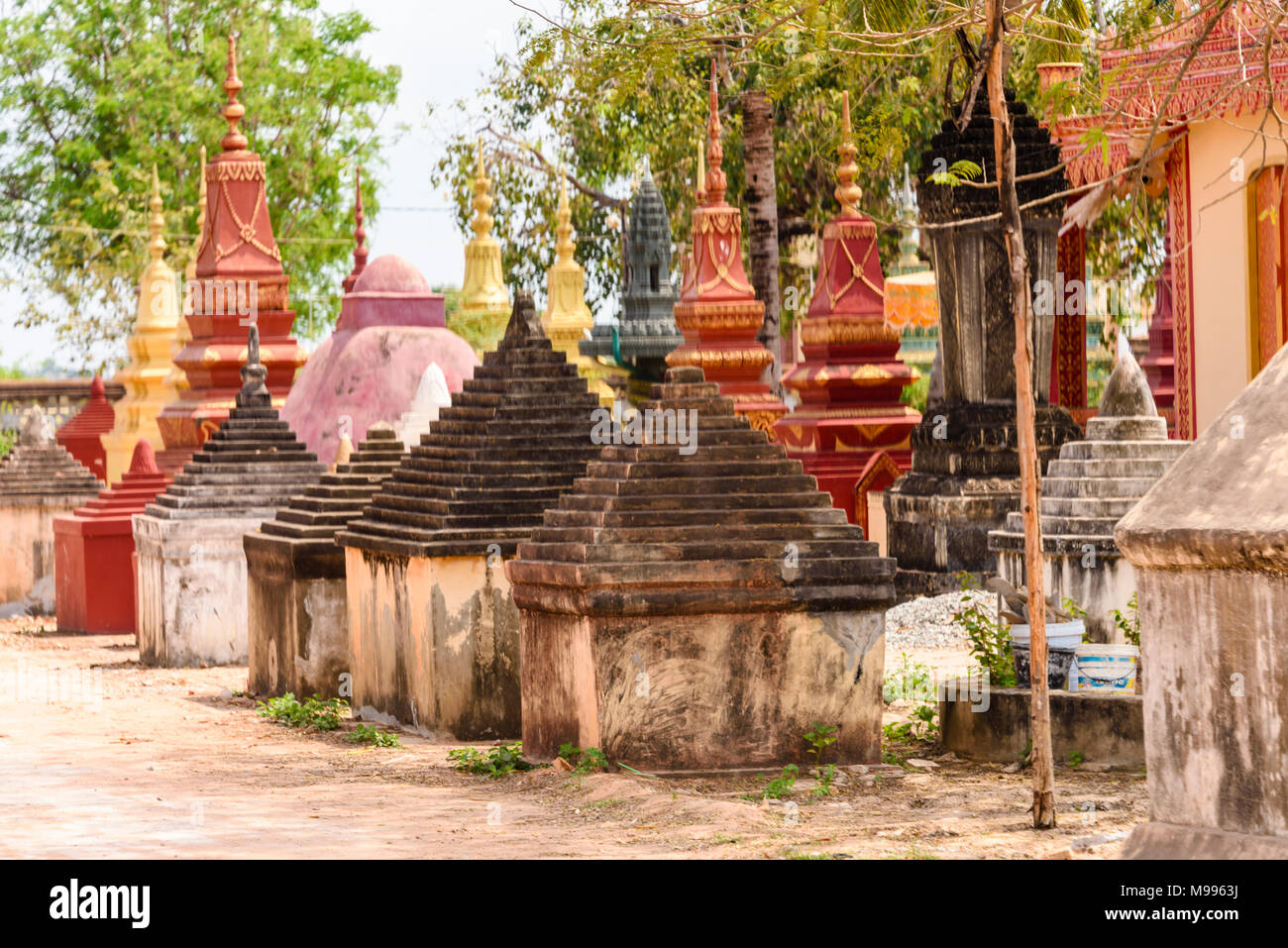Stupa, traditional Buddhist burial gravestones at a temple in a rural area of Cambodia Stock Photo