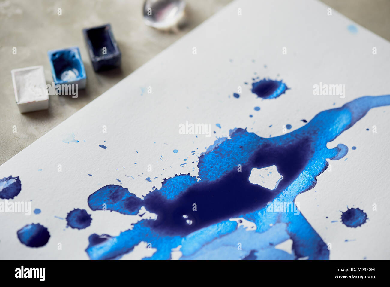 Blue ink blot art,the attributes for the artist Stock Photo Alamy
