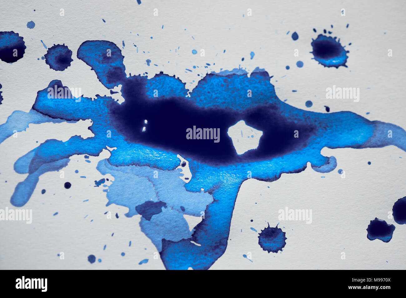 Blue ink blot art,the attributes for the artist. Stock Photo