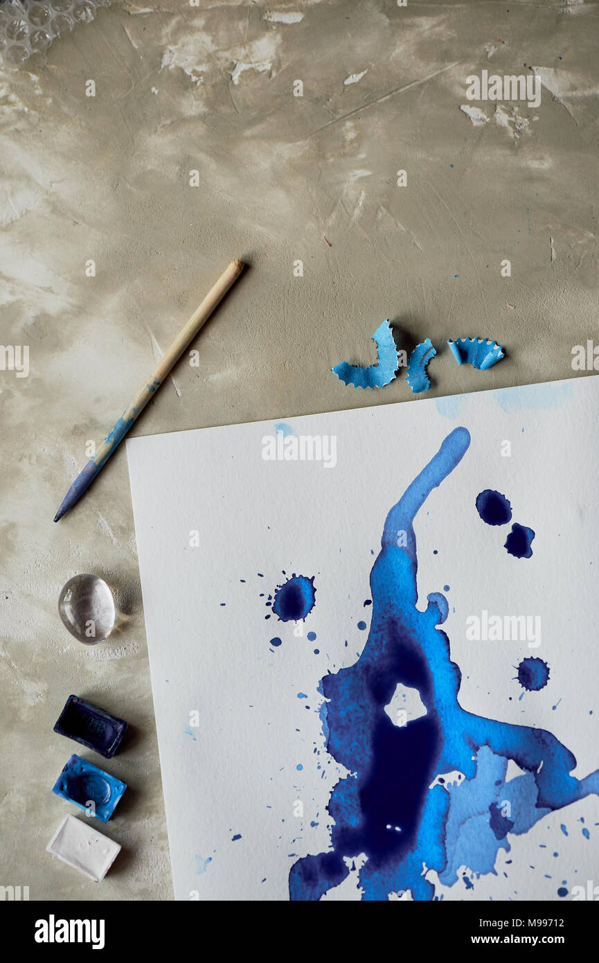 Blue ink blot art,the attributes for the artist Stock Photo Alamy