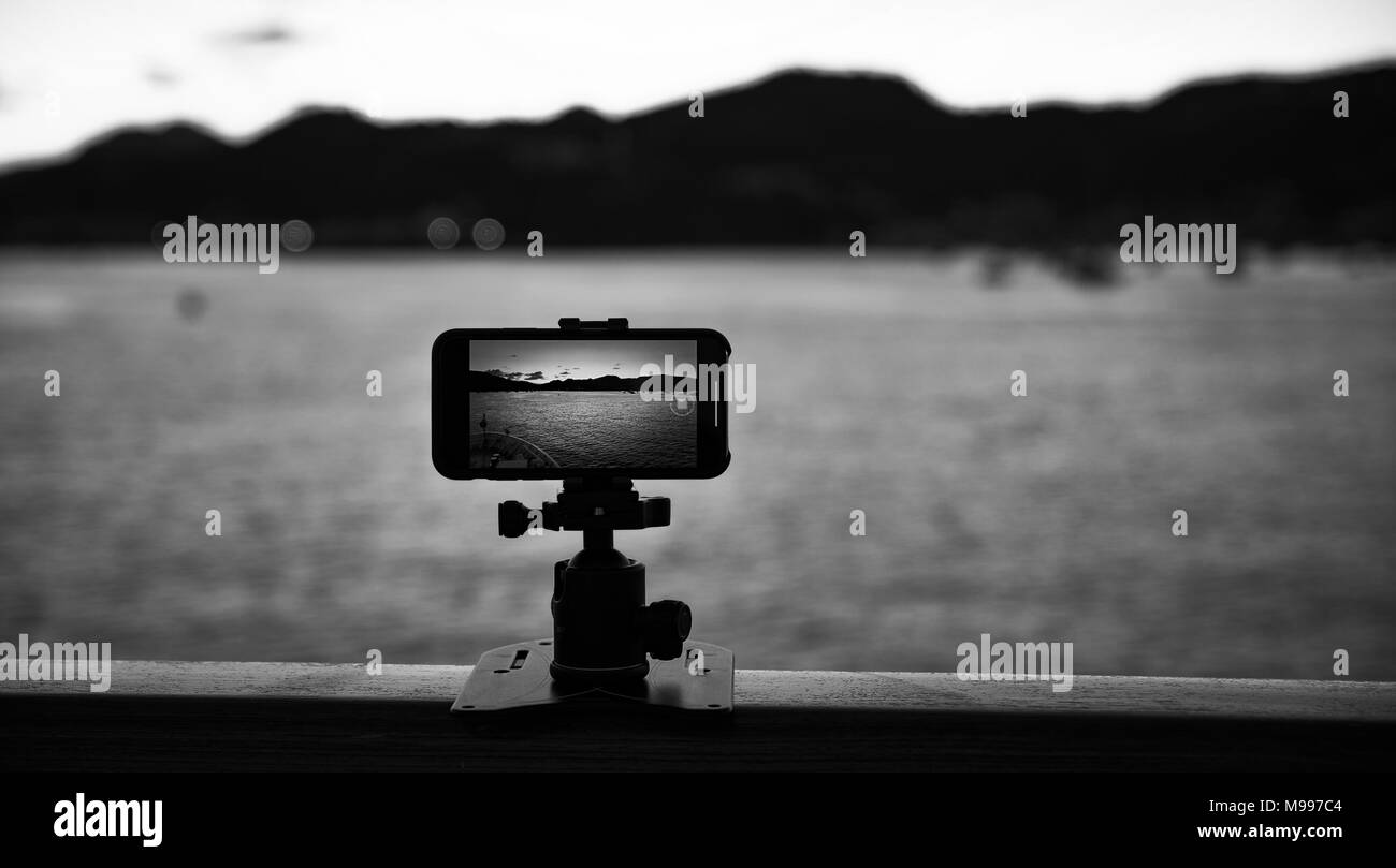 Smartphone camera filming a coastline landscape time-lapse Stock Photo