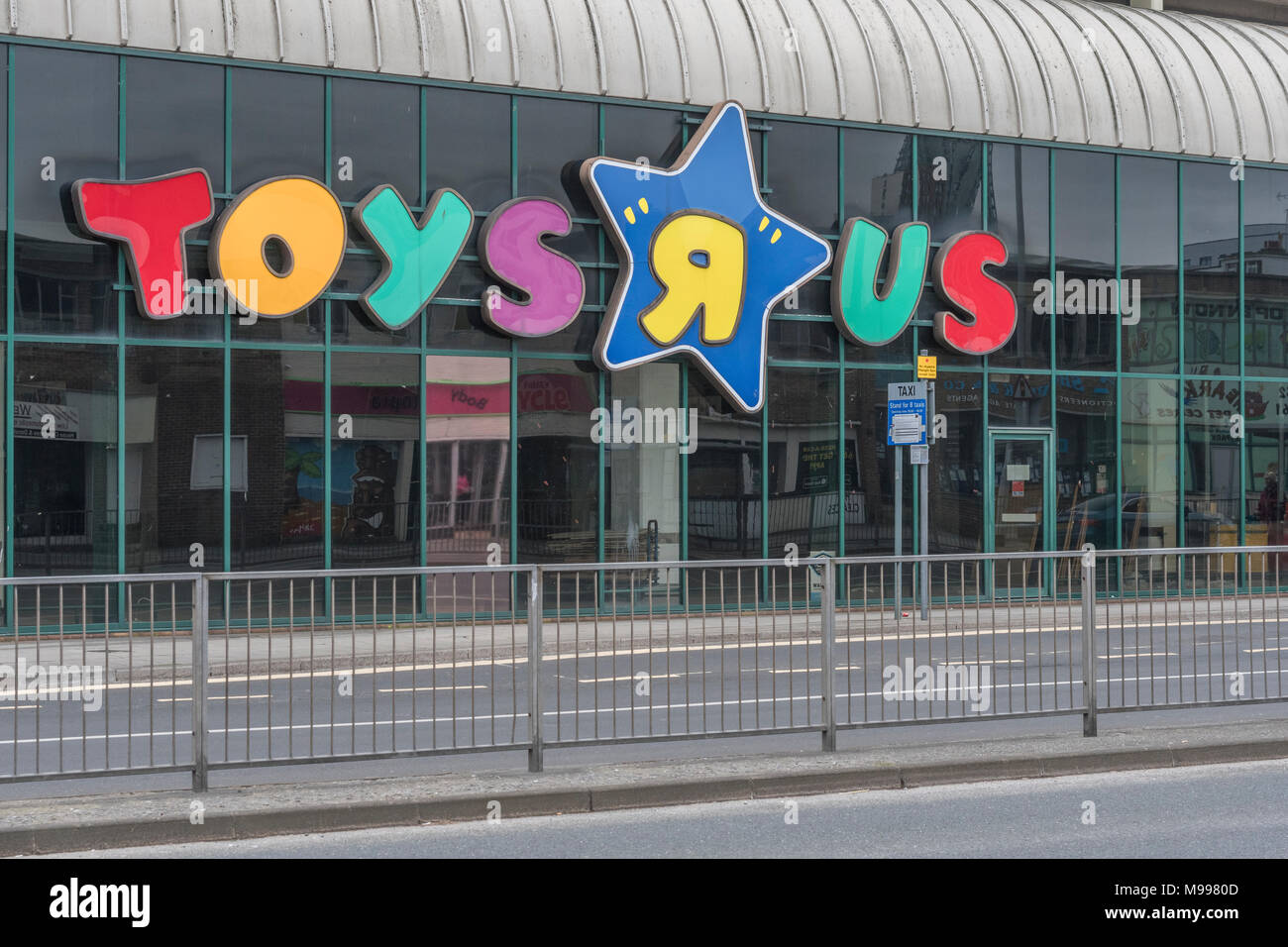 Front of the closed Toys R Us shop in Plymouth, Devon. Metaphor for high street retail casualties. Death of the high street metaphor. Stock Photo