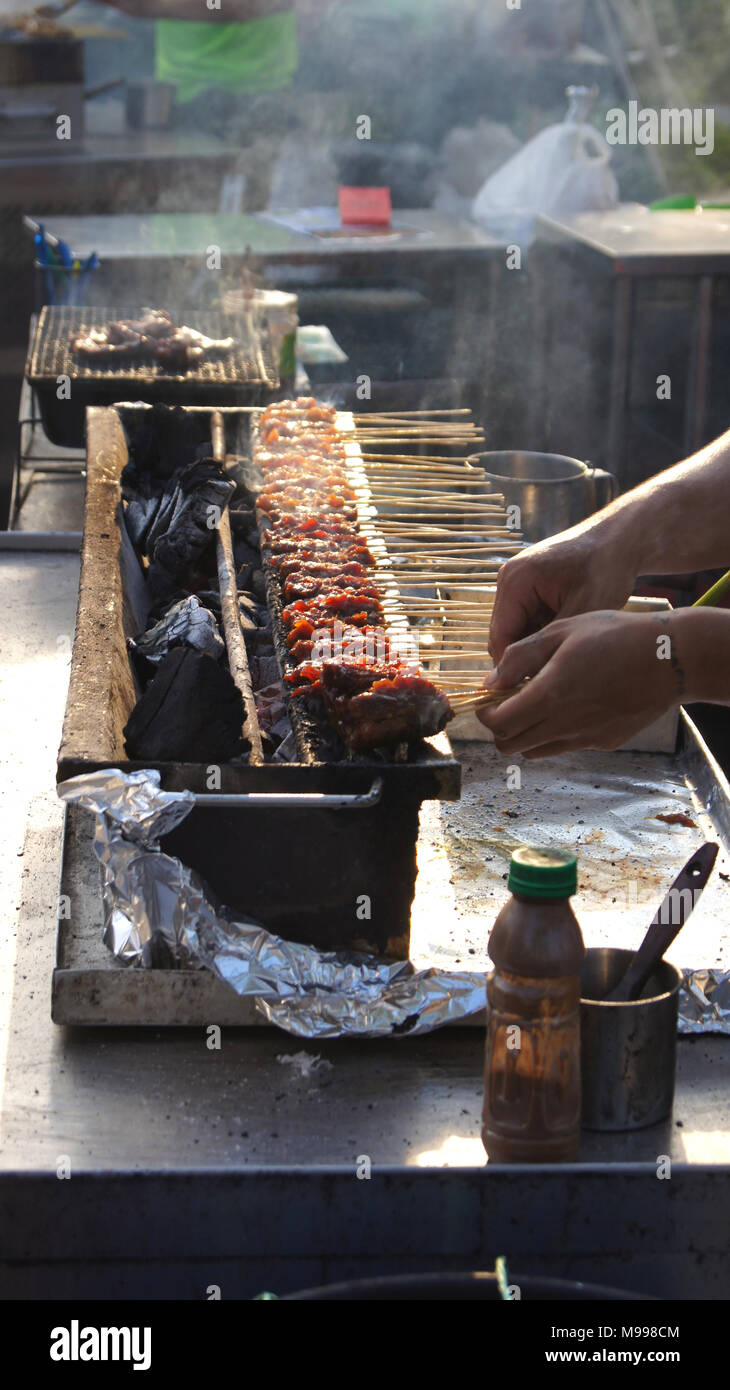 Singapore Apr 3rd 2015 Delicious Tasty Skewers Of Chicken Cook Over Hot Coals In Singapore S Satay Street Food Market Stock Photo Alamy