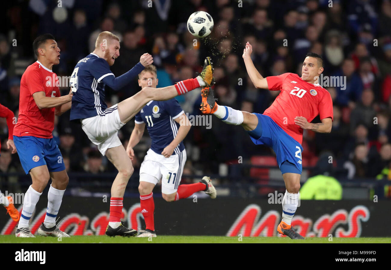 Scotland's Oliver McBurnie (left) and Costa Rica's David Guzman battle for the ball during the international friendly match at Hampden Park, Glasgow. Stock Photo