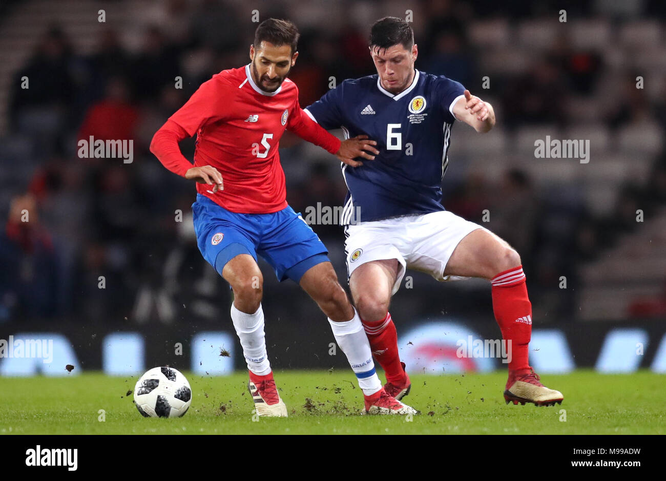 Scotland's Scott McKenna (right) and Costa Rica's Celso Borges battle for the ball during the international friendly match at Hampden Park, Glasgow. Stock Photo