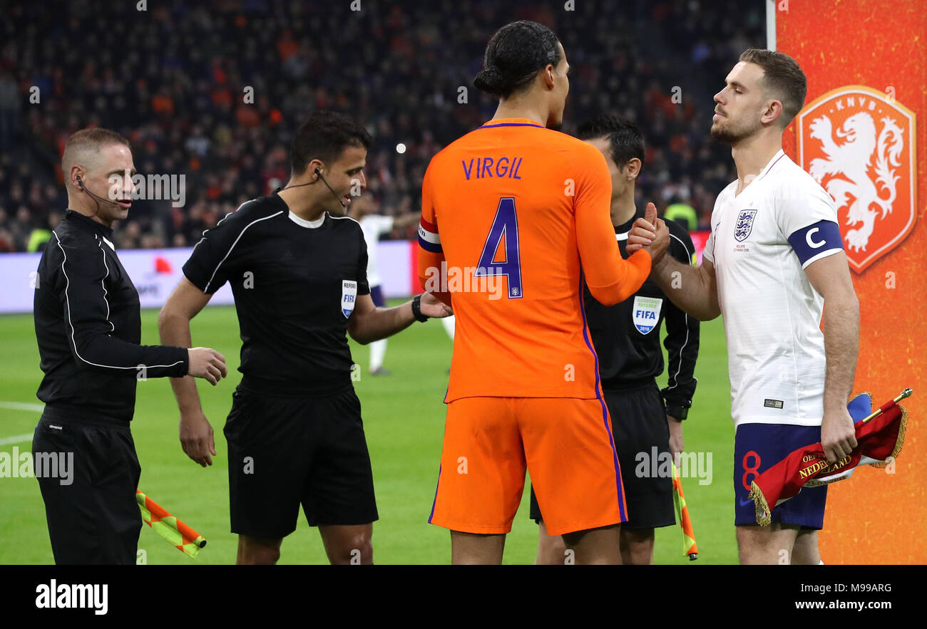 Netherlands' Virgil van Dijk (second right) shakes hands with England's  Jordan Henderson (right) after the final whistle during the international  friendly match at the Amsterdam ArenA Stock Photo - Alamy