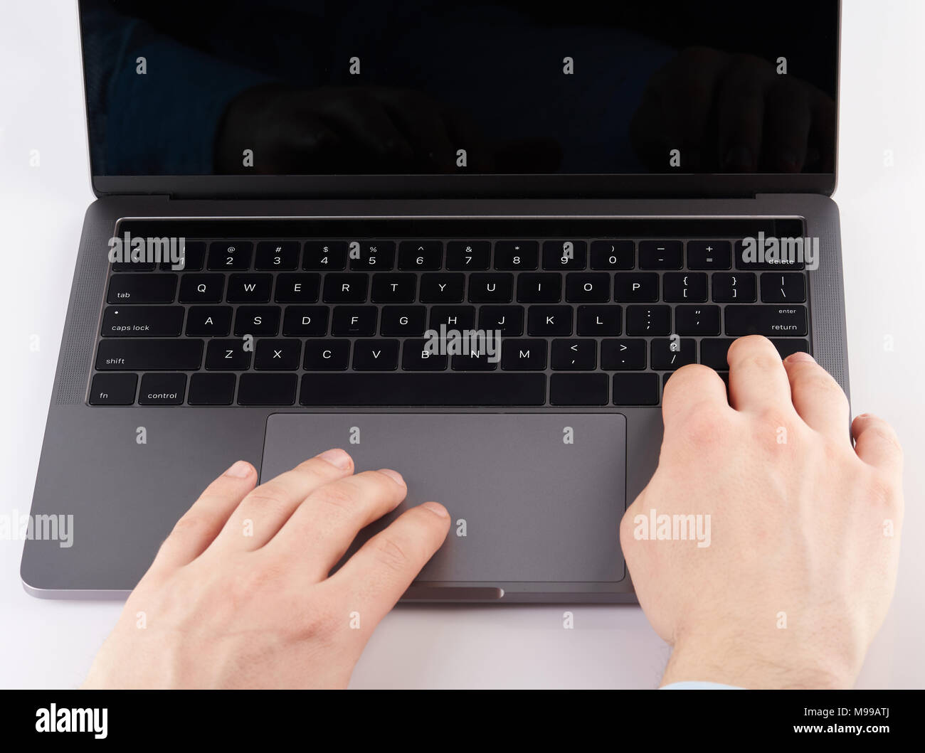 Typing on laptop close up isolated on white background Stock Photo