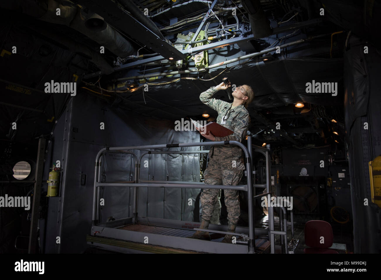Airman 1st Class Britainy Schmid, 364th Training Squadron hydraulic apprentice course student, inspects a booster pack for damage on a C-130 Hercules at Sheppard Air Force Base, Texas, Feb. 13, 2018. The booster pack powers the ailerons on the aircraft. Schmid is in block four of eight and scheduled to graduate March 21. (U.S. Air Force Stock Photo