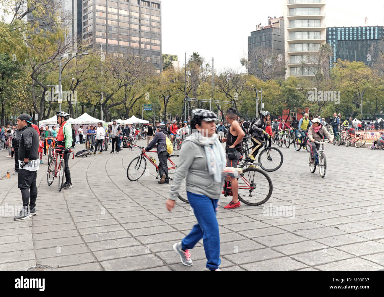 Mexico City residents take to the streets on Sunday morning along the Paseo de la Reforma, a thoroughfare closed to all but foot and bike traffic. Stock Photo