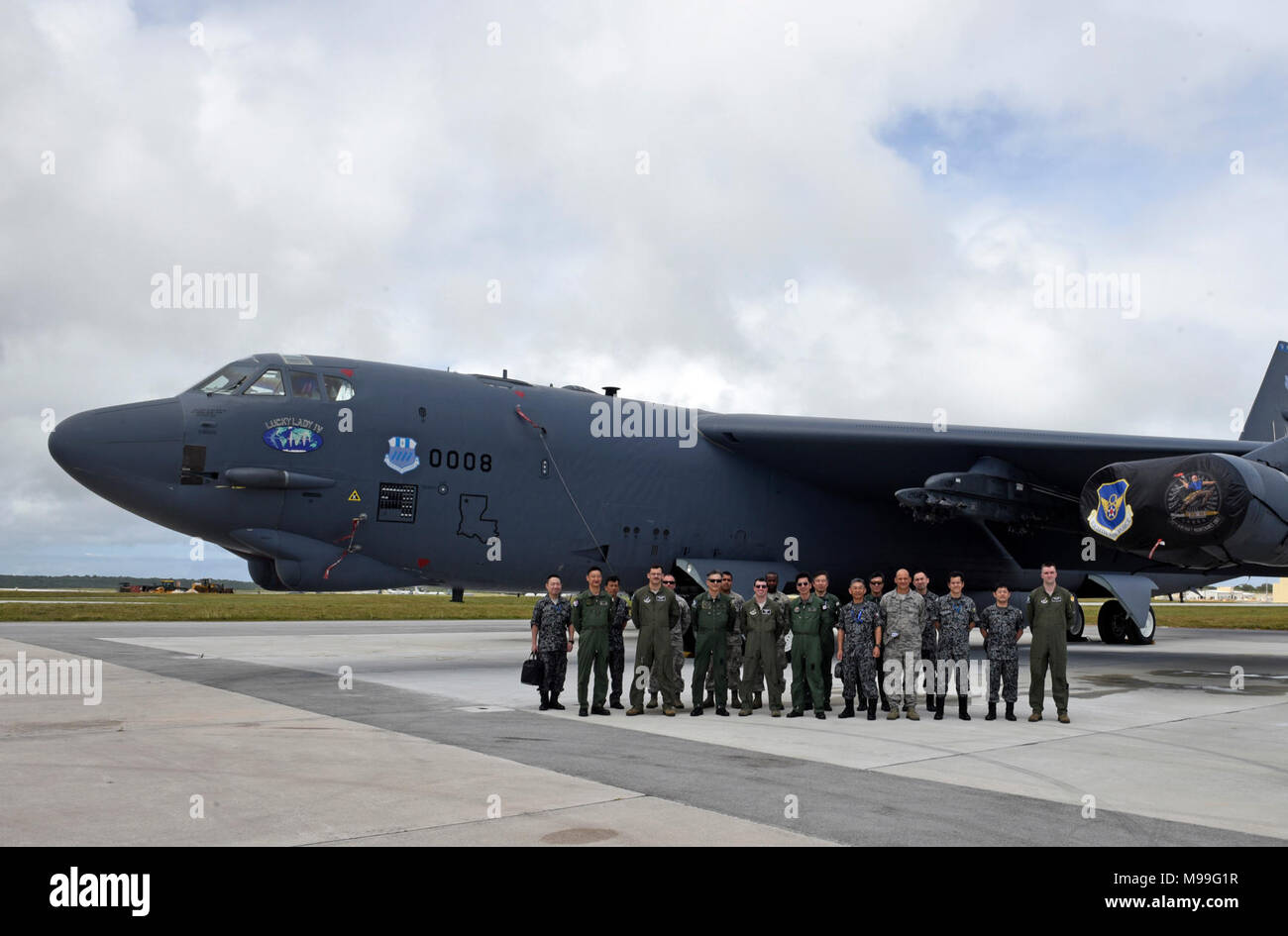 U.S. Air Force service members pose for a group photo in front of a B-52 Stratofortress with Koku Jieitai (Japan Air Self-Defense Force) leadership at Andersen Air Force Base, Guam, during exercise COPE NORTH 18 (CN18), Feb. 22.  CN18 is a model opportunity to practice humanitarian assistance/disaster relief in order to increase interoperability and readiness between the United States Air Force, Koku Jieitai (Japan Air Self-Defense Force) and Royal Australian Air Force. (U.S. Air Force photo/Airman 1st Class Gerald R. Willis) Stock Photo