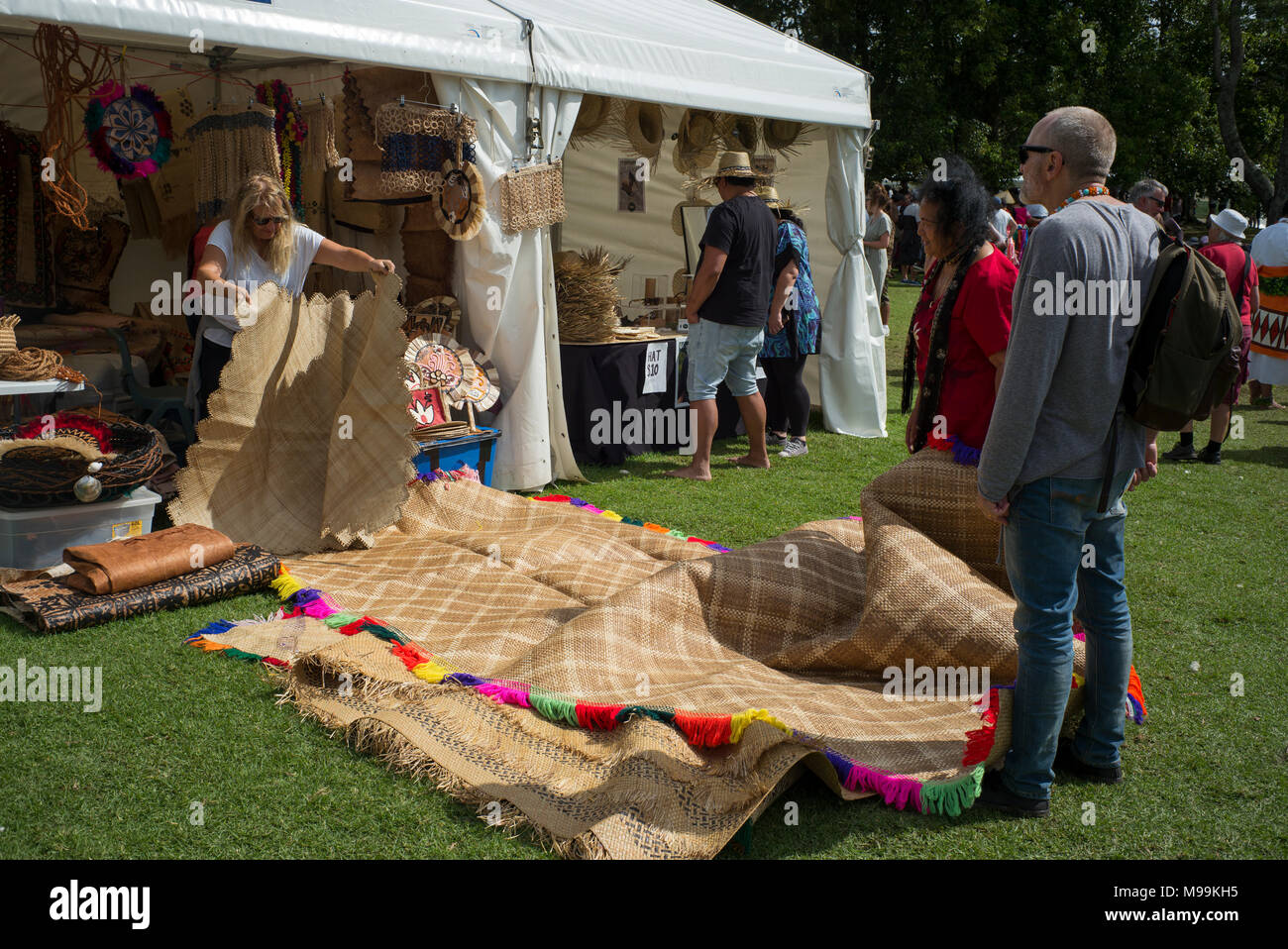 Fine mats brought out to show a potential purchaser at Pasifica, Pacific Island Festival, Auckland. Stock Photo