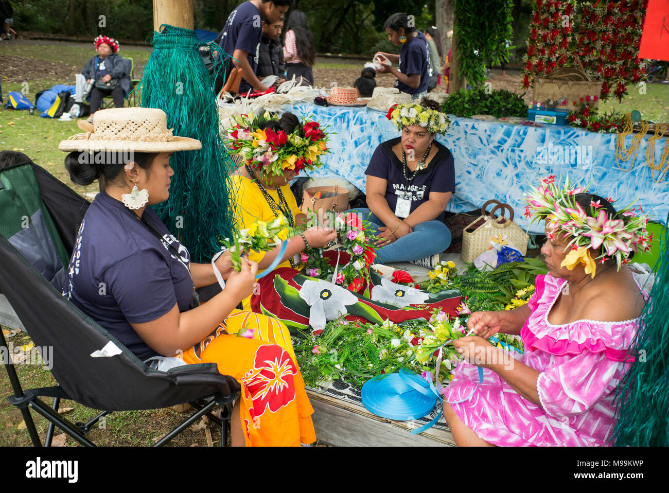 A group of Cook Island women make floral head gear at the Pasifica festival Auckland Stock Photo